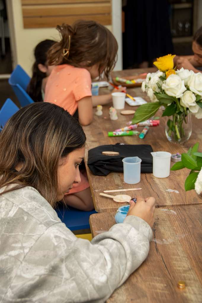 A guest concentrating on mixing colored wax