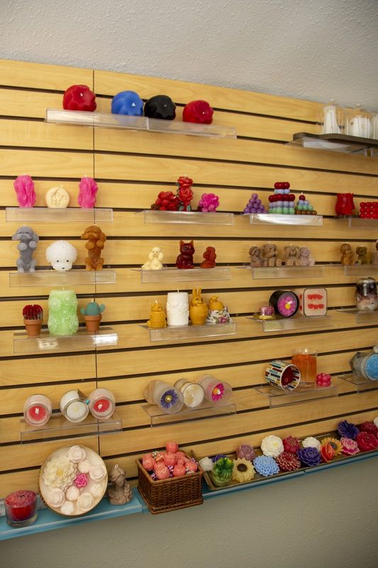 The slatted wall stacked with finished candles
